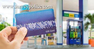 Man holding gas station gift card