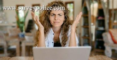 Survey taker sitting in front of computer
